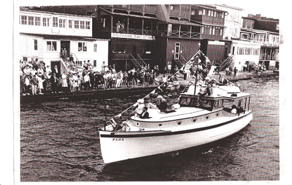 FLOX (shown with flybridge) passing in review for the 1972 Antique Boat Show, Clayton NY