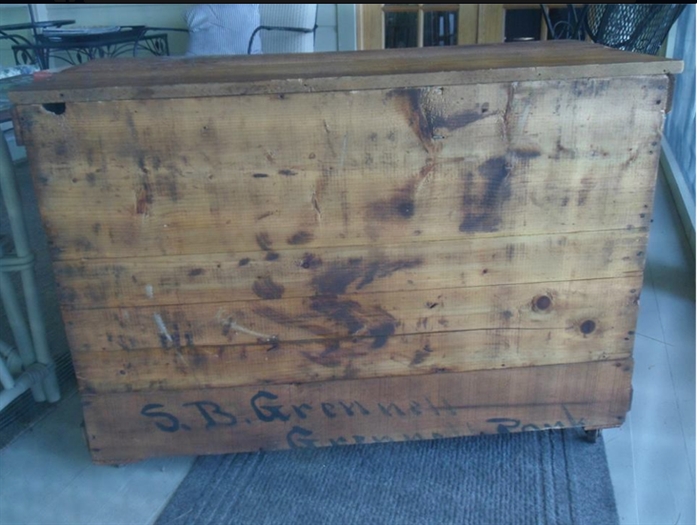 A crate addressed to the S. B. Grenell, found in the Dawes Cottage recently.