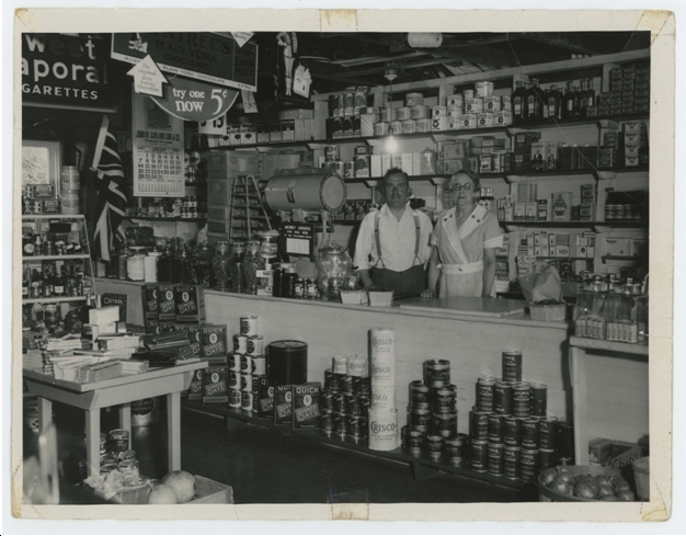 Albert Edward & Annie Biggs Mooney behind the counter. Barbara Landon Collection. LTI Archives
