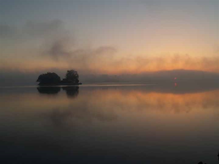 Hub Island surrounded by sunrise fog.