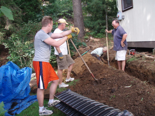 Neighbors help the Richards install a new leech field in 2009