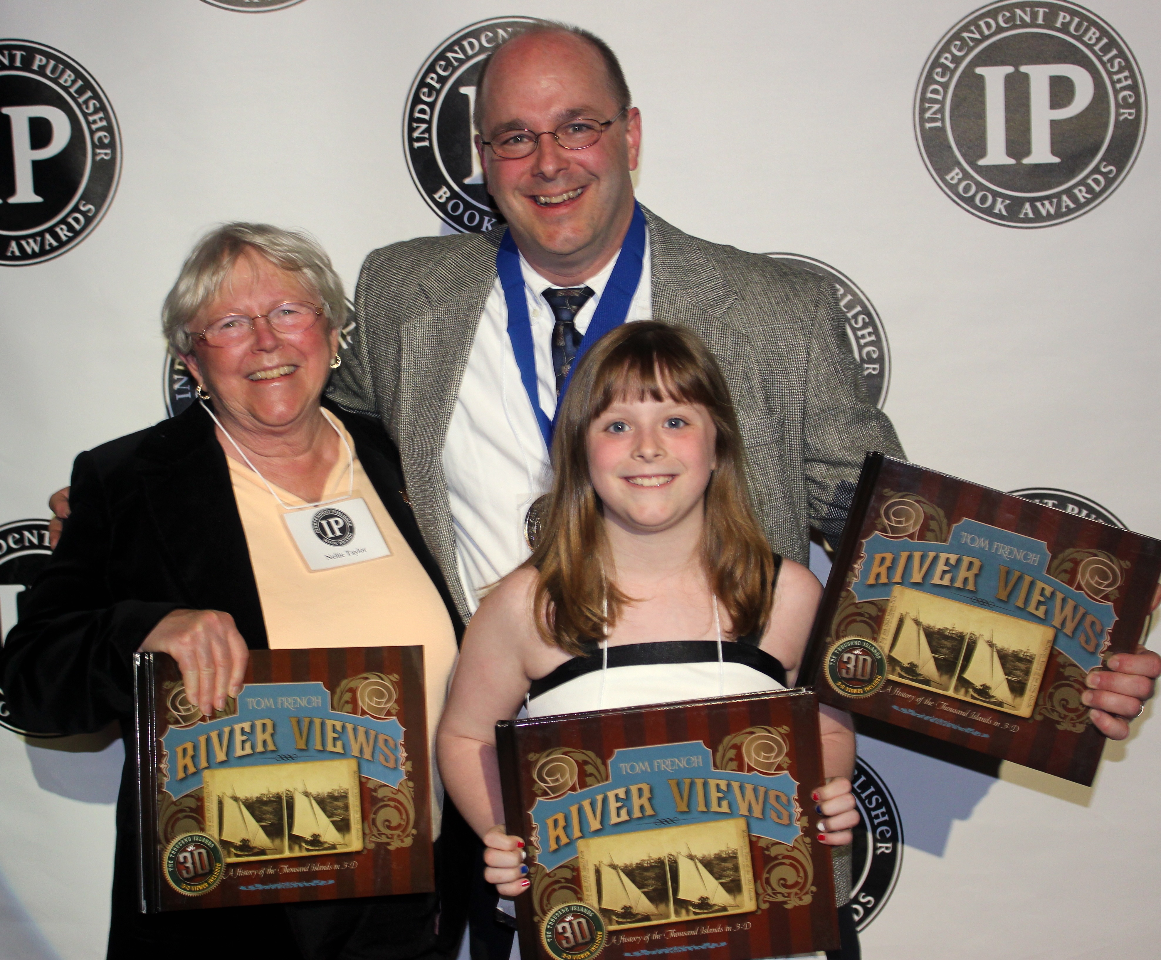 Author, Tom French with his mother Nelly Taylor and his daughter receive the IPPY Award in New York City. 