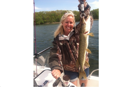Ann Rodenbeck with her first pike of the season.  Photo by Caitlin Rodenbeck 