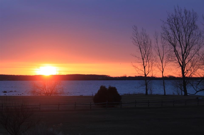 Easter morn. sunrise over Carleton Island and the St. Lawrence by Lynda Curthers
