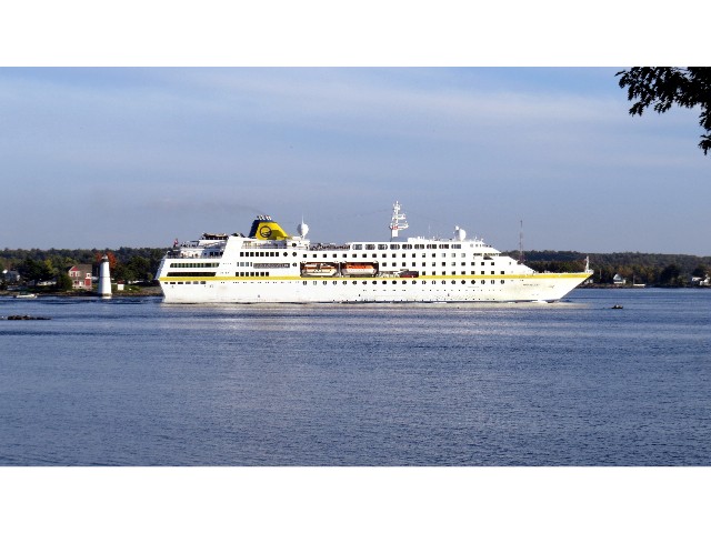 Cruise ship Hamburg passing Rock Island Light by Dennis McCarthy