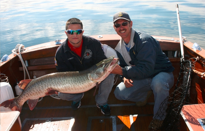 Jeff Garnsey on right with 52 inch catch which weighed 35 pounds. Caught fall 2012. Photo STR