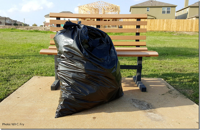 Green Garbage Bag in sun